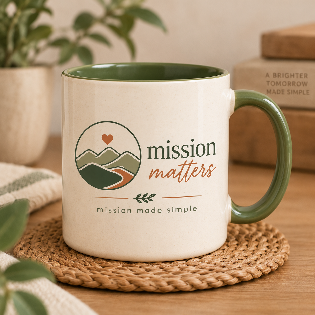 Mission Matters Mug with a green handle on a woven coaster.